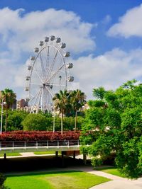 Ferris wheel in park against sky