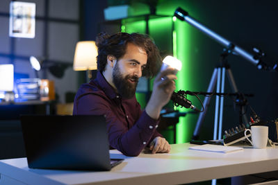 Young businesswoman using laptop on table