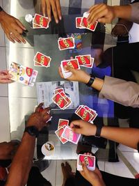 High angle view of people playing on table