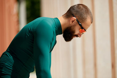 Side view of man exercising in gym