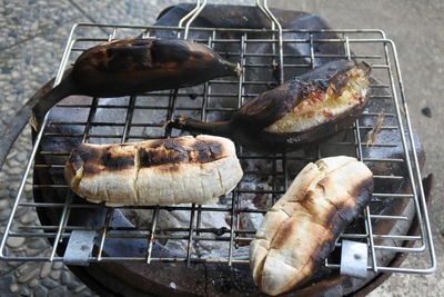 High angle view of meat on barbecue grill