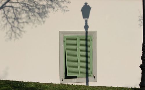 Close-up of window on wall against building