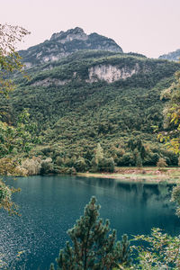 Scenic view of lake and mountains against sky