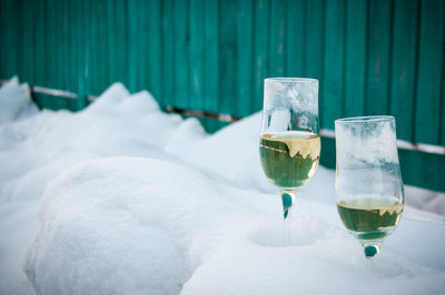 Champagne in glass on snow