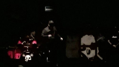 Full length of woman in dark room