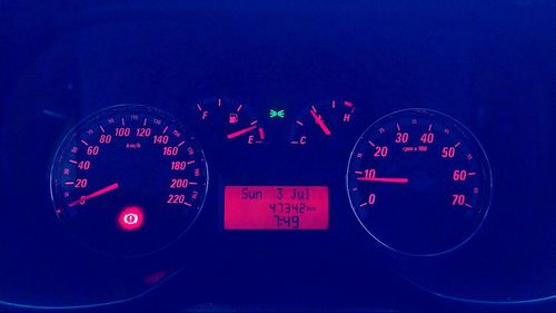 Close-up of clock on car windshield