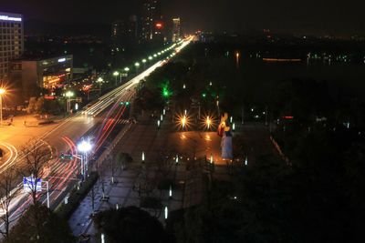 Illuminated city street at night