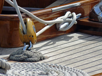 Close-up of ropes tied to pulley in boat