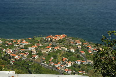 High angle view of townscape by sea