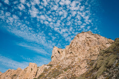 Rock formations against blue sky