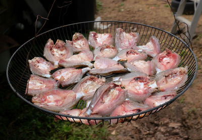 Fresh fish in a basket put to dry in the sun. thai food preservation.