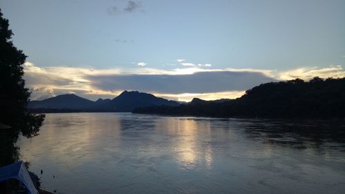 Scenic view of lake against sky during sunset