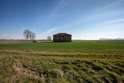 Farm in the middle of the meadows of the po valley
