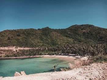 Scenic view of mountains against clear blue sky