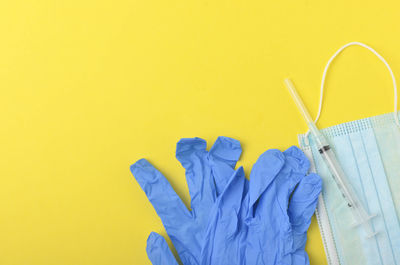 Close-up of multi colored pencils against yellow background