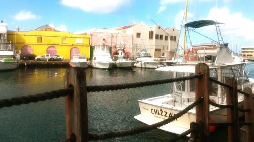 Boats moored at harbor