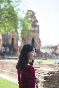 Young woman standing in temple