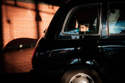 Portrait of woman sitting in car