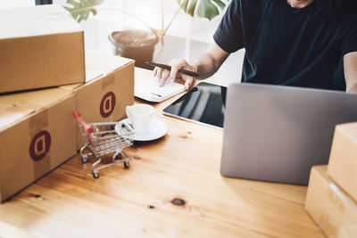 Midsection of man working in office