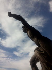 Low angle view of statue against sky