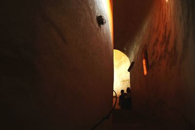 Man in illuminated corridor