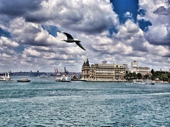 Buildings against cloudy sky