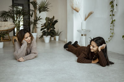 Woman sitting in corridor