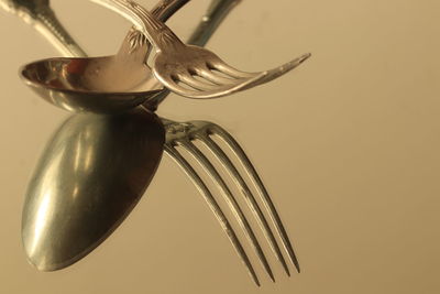 Close-up of fork over white background