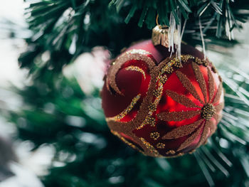 Close-up of christmas bauble on tree