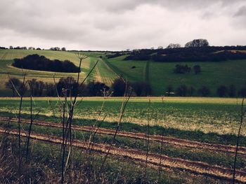 Countryside landscape against clouds