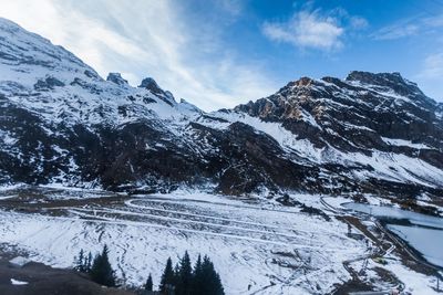 Scenic view of mountains against sky during winter