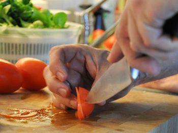 Cropped image of woman eating food