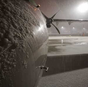 Close-up of airplane at night