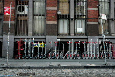 Push carts on sidewalk against building