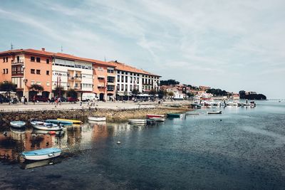 Boats moored at harbor