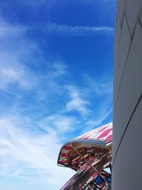 Low angle view of flag against blue sky