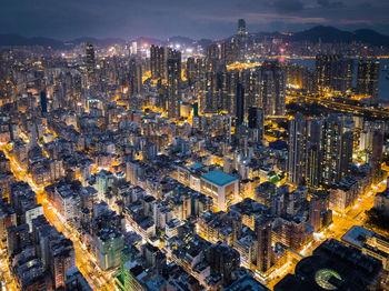 High angle view of illuminated city buildings at night