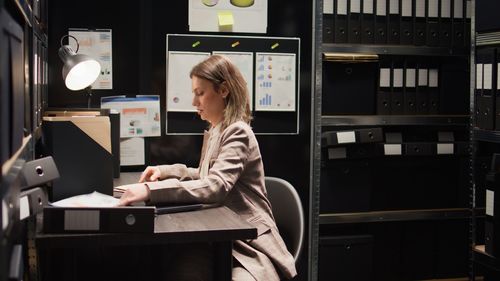 Portrait of woman using laptop at home