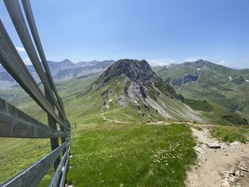 Scenic view of mountains against clear blue sky