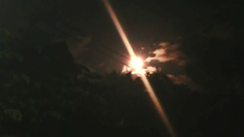 Low angle view of sun in sky