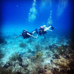 People swimming in sea