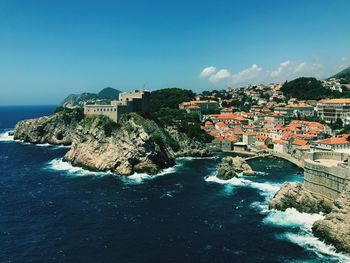 High angle view of town on sea