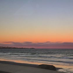 Scenic view of sea at sunset