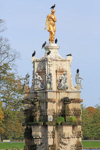 Low angle view of statue against sky