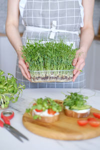 Midsection of woman having food