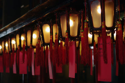 Close-up of illuminated lights hanging in building