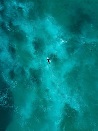 Aerial view of person surfing in sea