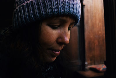 Close-up portrait of woman wearing hat