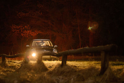 Car on field at night