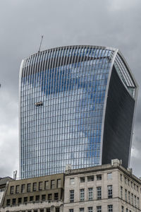 Low angle view of modern building against sky in london